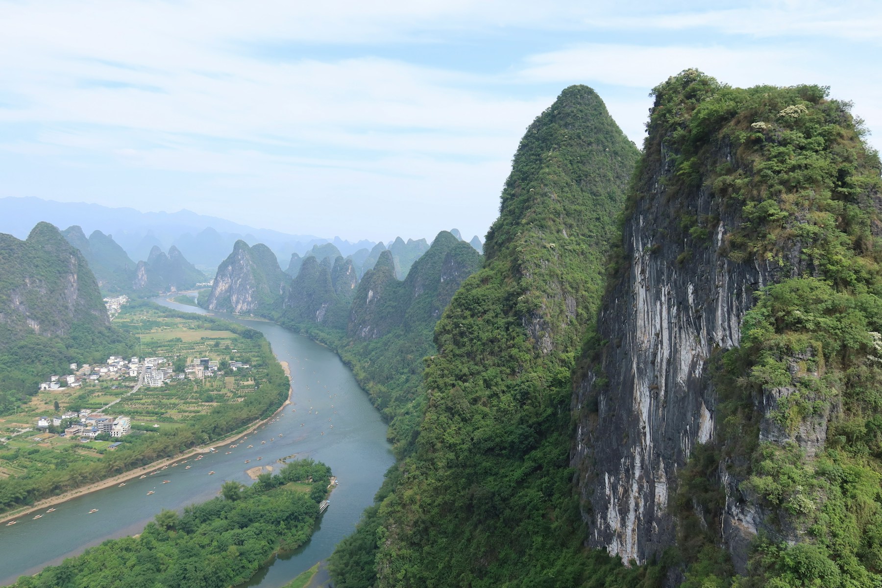 Green karst mountains surrounding a winding river in Guilin, China